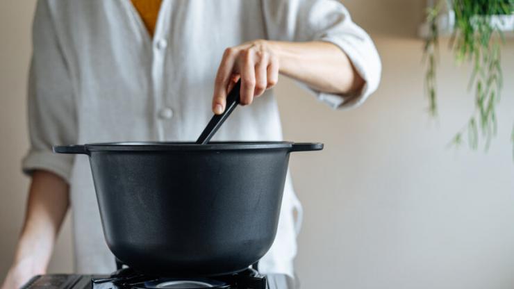 woman making soup