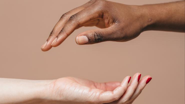 two hands almost touching