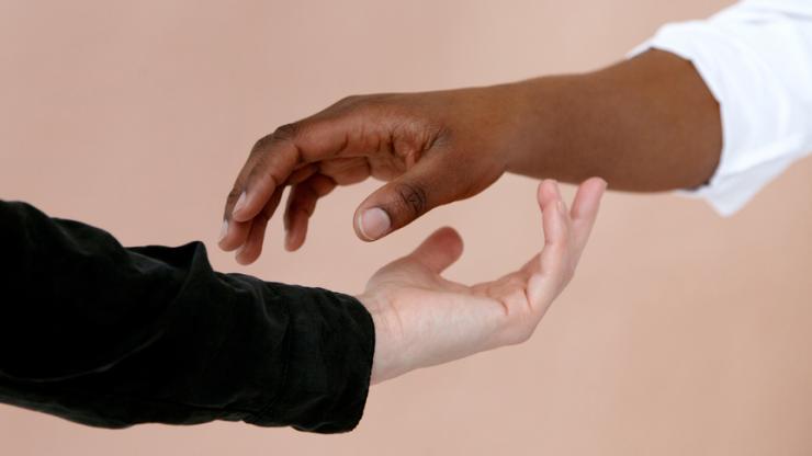 two hands reaching out