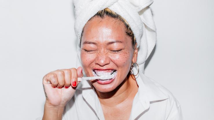 Woman brushing her teeth