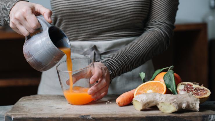 Woman pouring fresh juice