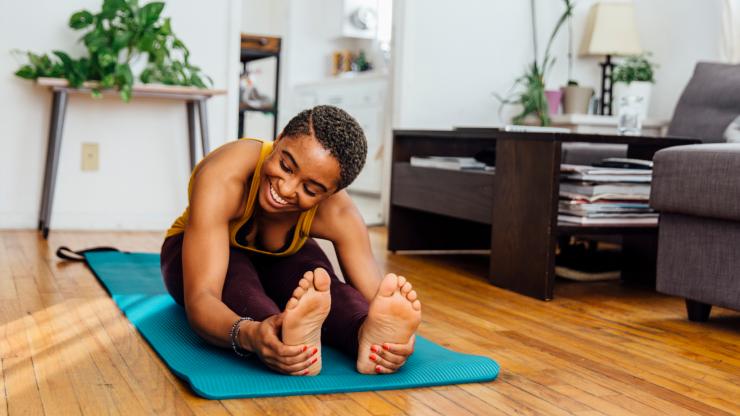 woman doing yoga at home
