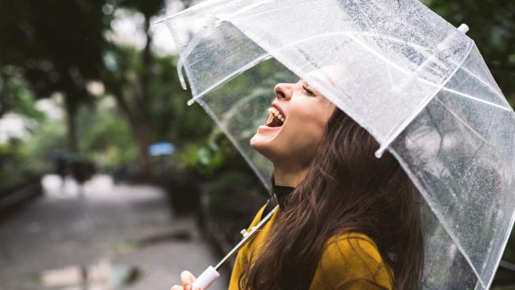 woman laughing in the rain