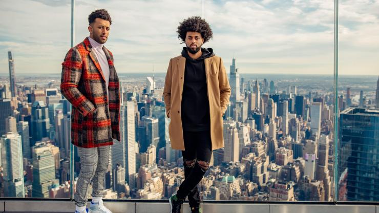 Founders of Foy: Moose and Yon Haile standing on the top of a NYC skyscraper