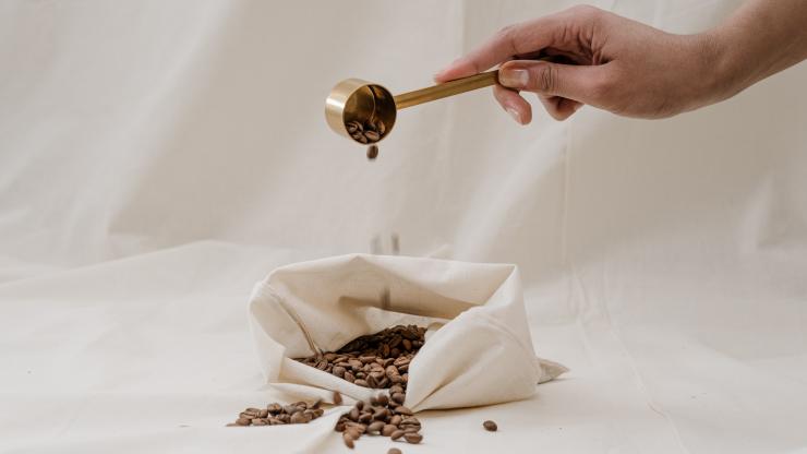 Hand Pouring Coffee Beans