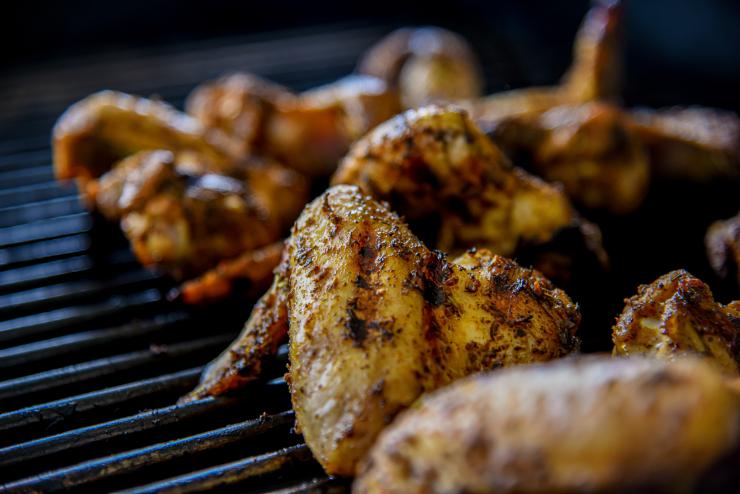 Grilled chicken cooking on the barbecue.