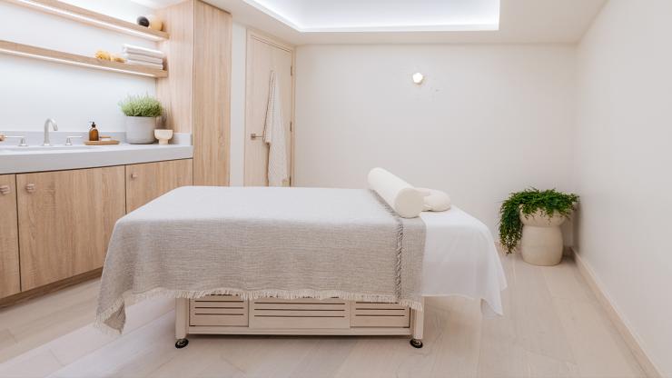 Massage table in one of THE WELL's treatment rooms.
